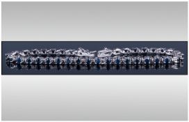 Silver Sapphire Set Tennis Bracelet, marked 925. Length 7.5 inches.
