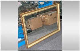 Modern Rectangular Mirror with gilt frame, 38 by 27 inches.