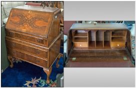 1950's Walnut Queen Anne Style Fall Front Bureau, with fitted interior and leather top. On three