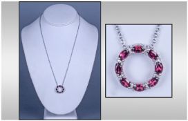 Rhodolite Garnet and Diamond 'Circle of Life' Pendant and Chain, eight oval cut, faceted, berry with