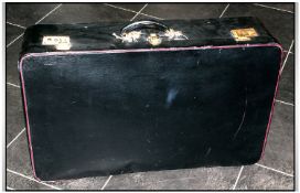 Large Black Suitcase with Red Trim.