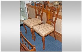A Pair Of Edwardian Bedroom Chairs, with upholstered seats and a carved central splat. Cabriole