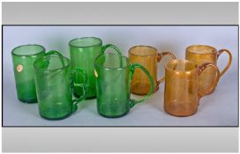 Collection of Free-Blown Coloured Glass Tankards, comprising three large green mugs, with strap