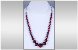 Faceted Cherry Amber Coloured Bead Necklace, with white metal chain and clasp.