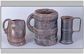 Three Early 17th/18th Century Beer Tankards Of Mixed Mediums. A Leather Jack of small size with