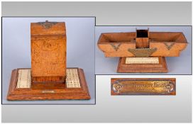 A Late Victorian Shaped Cribbage Board with a cabinet compartment which opens to reveal the card