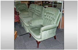 A Three Piece Modern Lounge Suite comprising two arm chairs and two seater settee with button