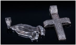 Two Large Religious Silver Pendants. One in the form of a cross pave set with white CZ stones. The
