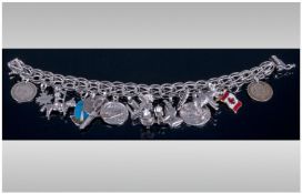 A Silver Fancy Bracelet, Loaded with 16 Charms, All Fully Marked Silver 925. 51.7 grams.