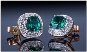 9ct Gold Emerald And Diamond Stud Earrings, set with a central emerald surrounded by a single row of
