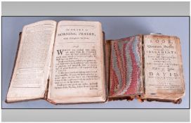 Two Early Leather Bound Bibles. One book of common prayer, printed by John Basket, Oxford. The other