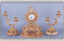 Set Of Three Ormolu Clock On Marble Bases. Consisting of a clock in the Rococo style with a white