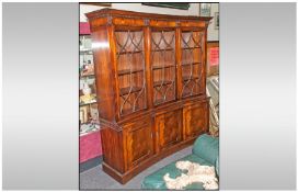 A Reproduction Mahogany Three Door Astral Glazed Display Cabinet, the top and base are concave