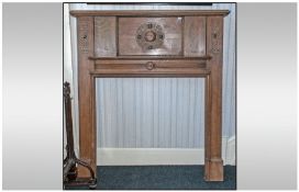 Jacobean Style Oak Fire Place. Circa 1930's. With a carved rounded centre and carved side