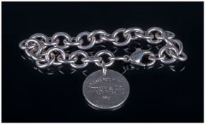 White Metal Bracelet, with circular disk fob marked "Tiffany"
