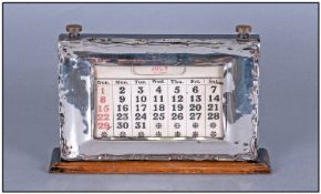 A Silver Framed Desk Calendar, with wood stand and back. Hallmark Birmingham 1930. Stands 5.25