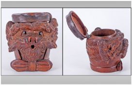 A Finely Carved Black Forest Dogs Head Tobacco Box Of Large Size, the dog is wearing a traditional