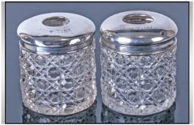 1920s Pair Of Silver Topped Cut Glass Hair Tidy Jars. Hallmark Chester 1927. Each 3 inches high.