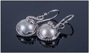 Pair of White Freshwater Mabe Pearl Snake Earrings, the ivory white pearls, naturally flat to the