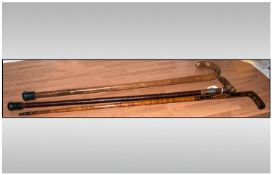 Three Walking Sticks one bend cane, one beech wood cane with silver ferrel & the other with inlaid