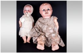 1930`s Celluloid Body Baby Doll, together with a German Bisque headed Armand Marseille doll with