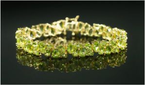 Peridot Pear and Oval Cut Cluster Bracelet, bright vivid green peridots in clusters, each