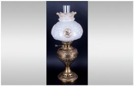 A Good Quality Edwardian Table Brass & Glass Oil Lamp, Maker Veritas with original shade. Circa