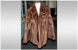 Ladies Musquash Light Brown Jacket, fully lined. Collar with revers & hook & loop fastenings. Slit