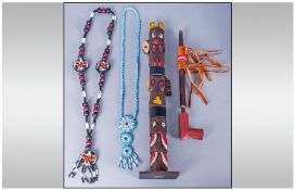 Collection of Tribal Items including beaded necklaces, totem pole etc