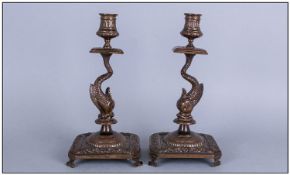 Pair Antique Florentine Cast Bronze Candlesticks in the form of a Dolphin Holding up the Sconces,