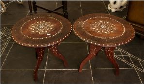 A Pair of Indian Teak Circular Side Tables on collapsible stands with floral bone inlay. 17 inches