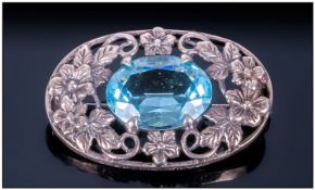 A Vintage Oval Silver Brooch Comprising Of A Large Centre Faceted Oval Aquamarine Coloured Stone,