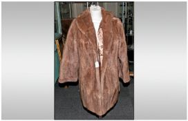 Ladies Pale Brown Three Quarter Length Musquash Coat, fully lined. Slit pockets. Approximate size