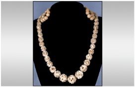 Antique Graduated Ivory Bead & Floral Necklace with silver clasp. 33`` in length.