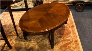 Oval French Style Mahogany Coffee Table on 4 reeded square legs with a shaped under carriage. 44