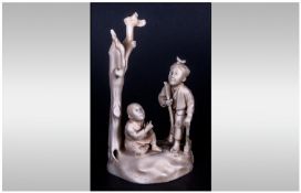 Japanese  - Signed Early 20th Century Carved Ivory Group Figure ` Two Figures by a Tree, One Figure