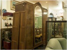 A Large Continental Sectional Walnut Wardrobe c 1930`s. With a carved shaped dome top and a large