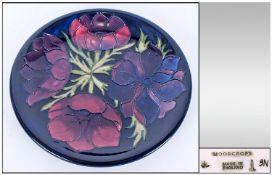 W.Moorcroft Modern Cabinet Plate `Clematis` Design on dark blue ground. Circa 1990`s. 10`` in
