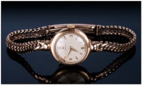 Omega Ladies 9ct Gold Cased Wristwatch fitted to integral 9ct gold bracelet. Fully Hallmarked.