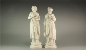 Pair of Parian Figures `Muses of Art and Music`, both dressed in Greco-Roman style, one looking