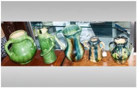 Five Various Belgian Green Art Pottery Items comprising three vases and two jugs, with a heavy