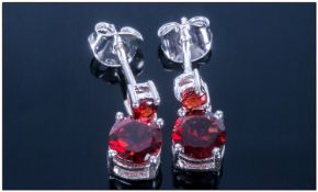 Deep Red Garnet Drop Earrings, round cut garnets suspended below smaller similar stones, 2.25cts in
