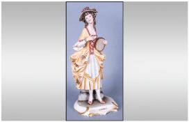 Capodimonti  `Gilbert and Sullivan` Figure, Patience. In yellow ochre, brown and white dresss and