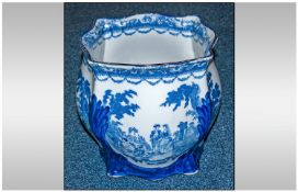 Large Blue & White Jardiniere, depicting a couple in a garden setting. 9.5`` in height, 9.75`` in