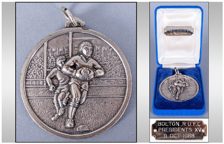 Bolton RUFC Presidents XV Silver Plated Medal, in original box, the medal showing a player running