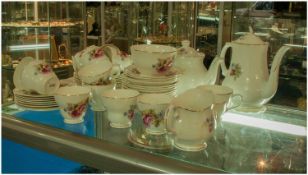 Bone China Coffee Set comprising coffee pot, teapot, cups, saucers and side plates. Pink floral