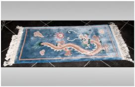 Chinese Embossed Carpet, with dragon decoration in pale blue, 48x23``
