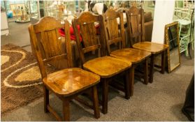 A Set of Four 1960`s Oak Dining Chairs in the `Swiss Chalet` Style