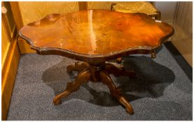 Italian Inlaid Walnut Venereed Shaped Top Coffee Table. 22 inches high.