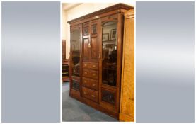 Large Late Victorian Mahogany Princess Wardrobe, with a bank of four draws to the centre with a two